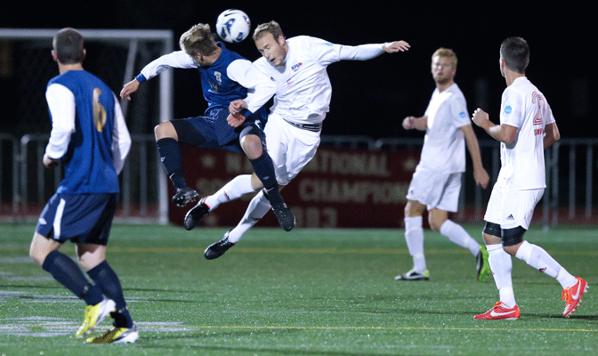 SFU's Alexander Kleefeldt (white, center) was named Red Lion Defensive Player of the Week as he scored and helped the Clan limit Western Washington to one shot on target in a 2-0 win.